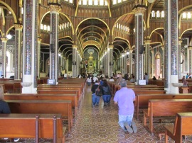 Penitent worshipers process to the altar of La Basílica on their knees.