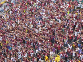Hundreds of Saprissa fans crowd into the fan section equipped with drums, jerseys and chants.