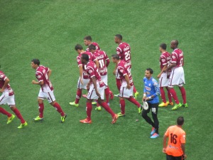 The Saprissa team breaks from their huddle, ready to start the game.